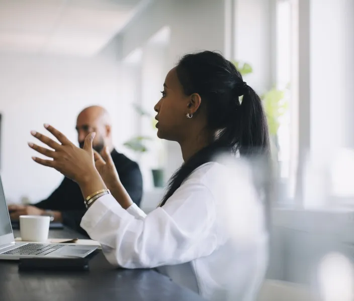Woman making point in meeting