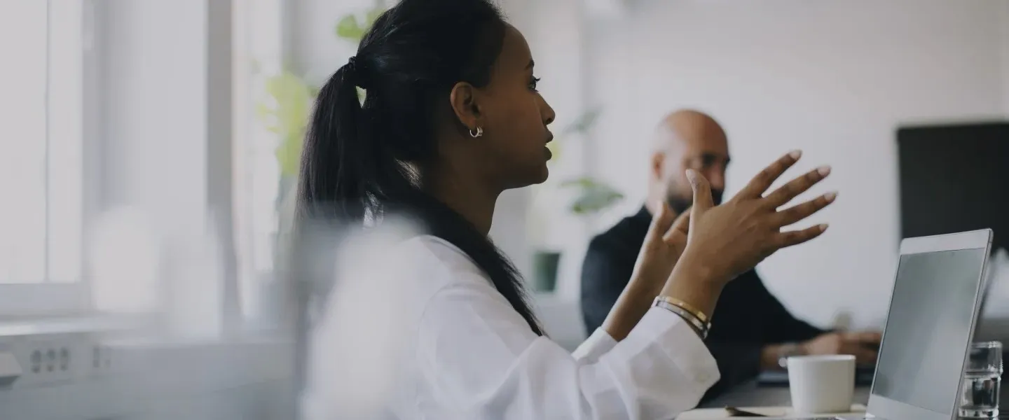 Woman making point in meeting