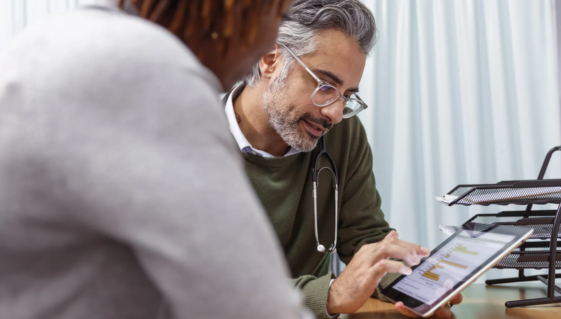 Dr. discussion data with a patient