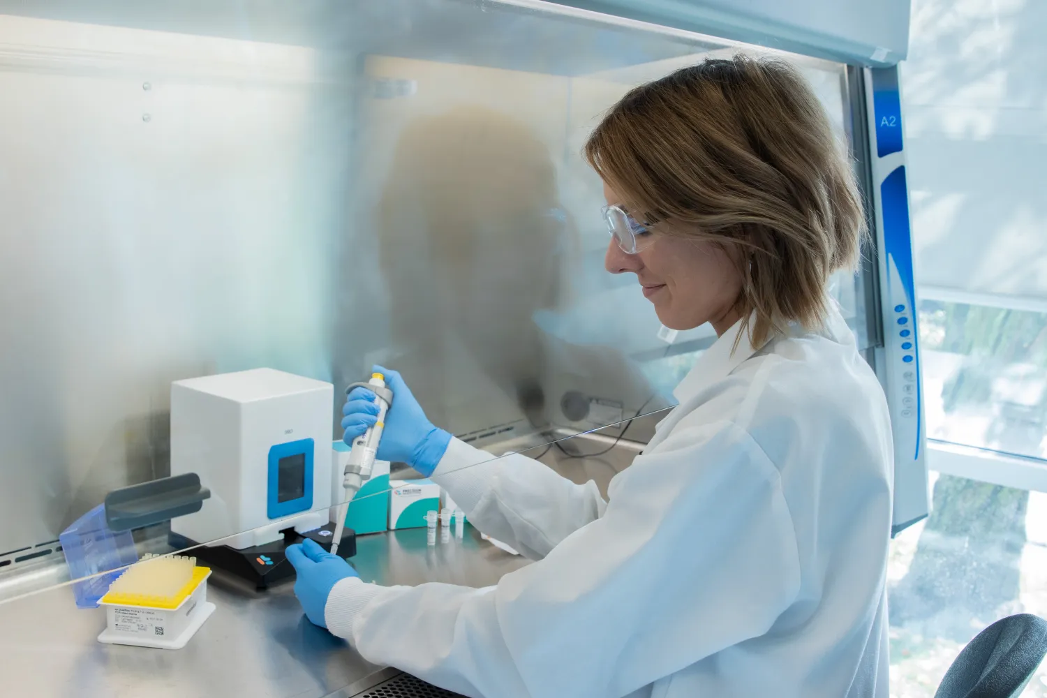 Scientists working in a Lab on NanoAssemblr® Spark™