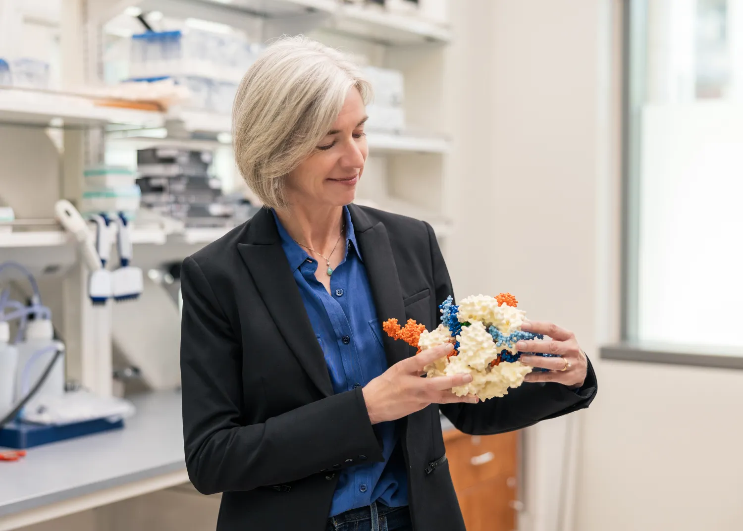 Jennifer Doudna holds a CRISPR model