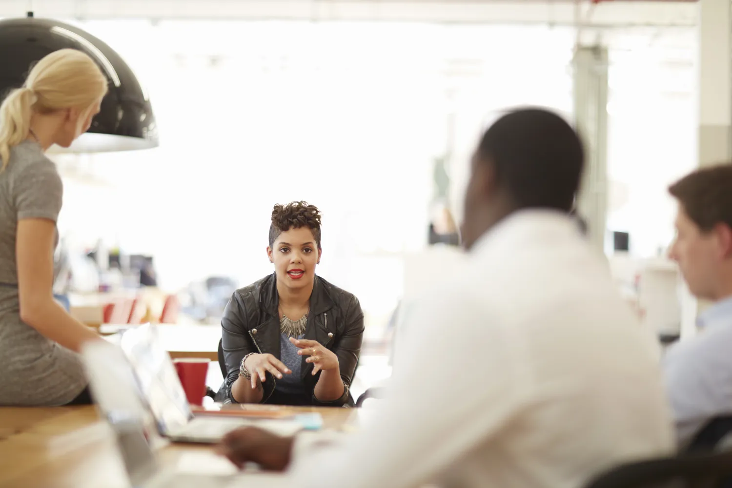 Associates at a table in conversation